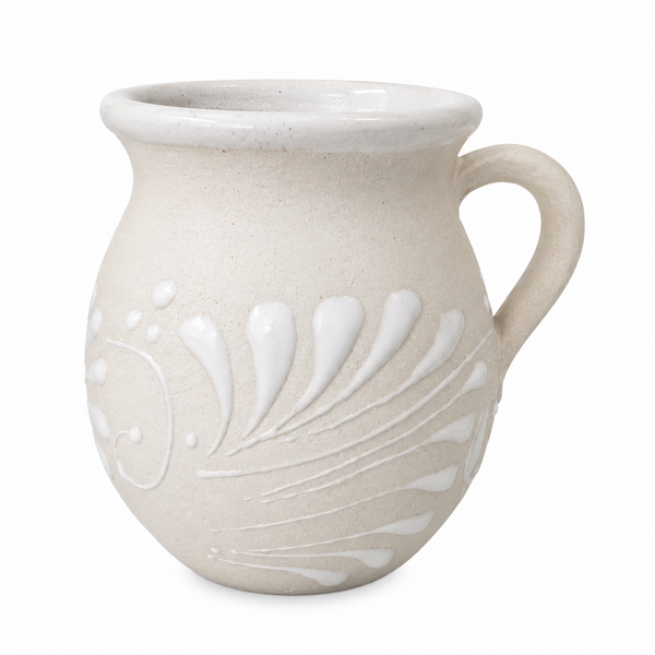 White ceramic mug with decorative patterns on a white background