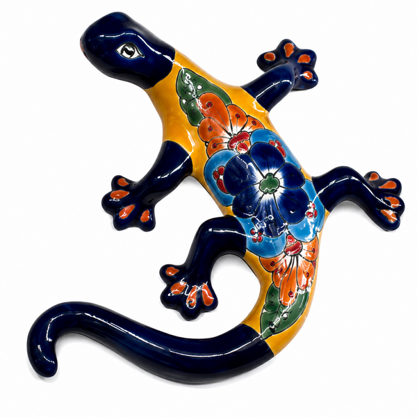 Decorative ceramic lizard with colorful floral patterns on a white background