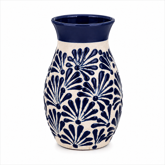 Ceramic vase with blue floral pattern on a white background