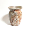 Ceramic vase with a deer design on a white background