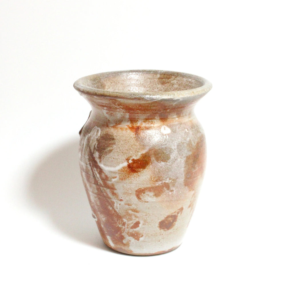 Ceramic vase with brown and beige glaze on a white background