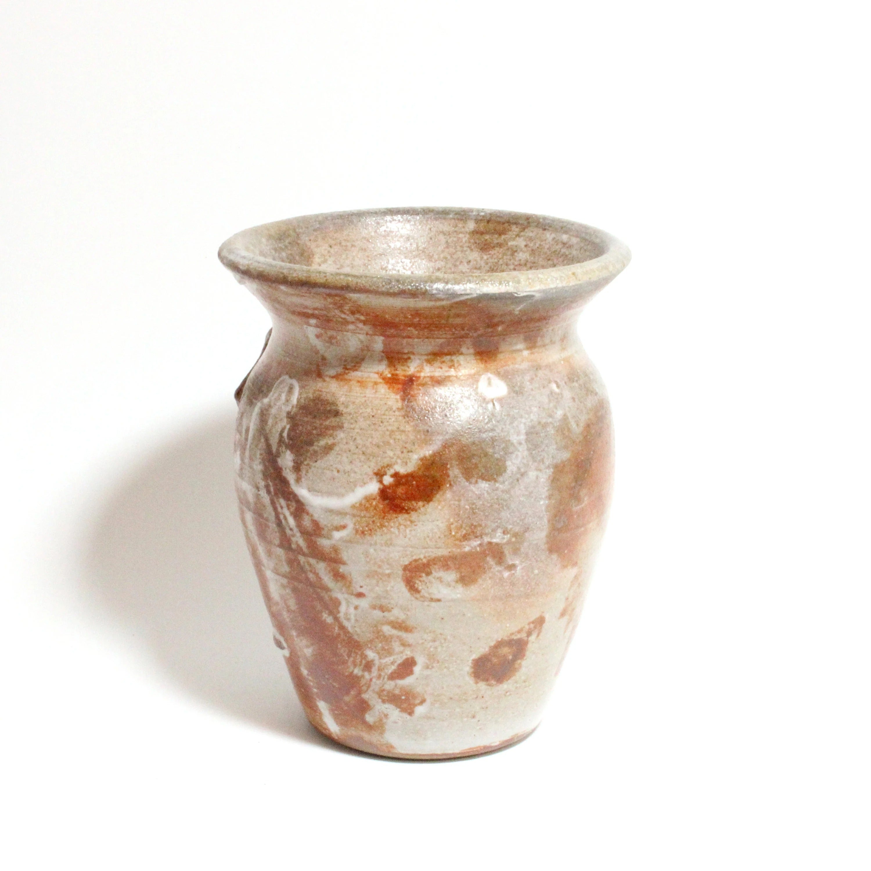 Ceramic vase with brown and beige glaze on a white background