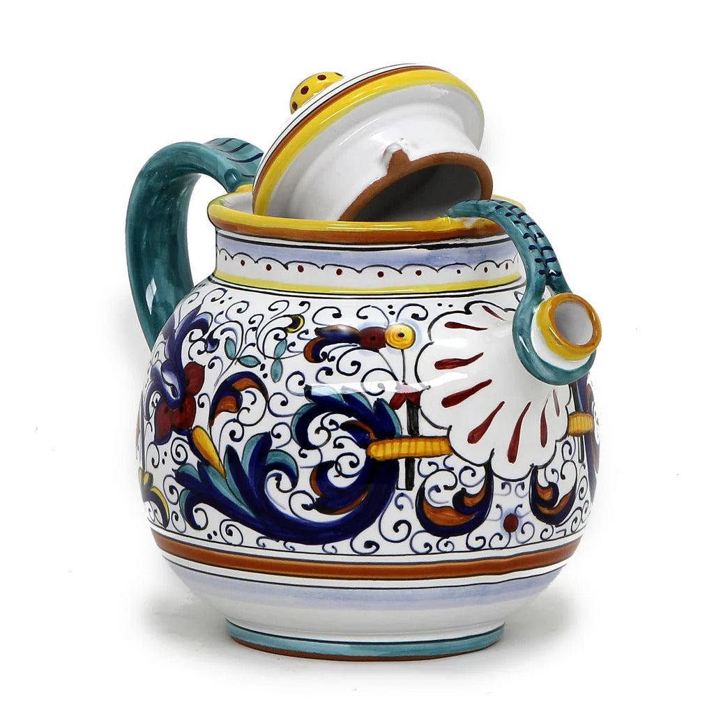 Decorative ceramic teapot with colorful patterns on a white background