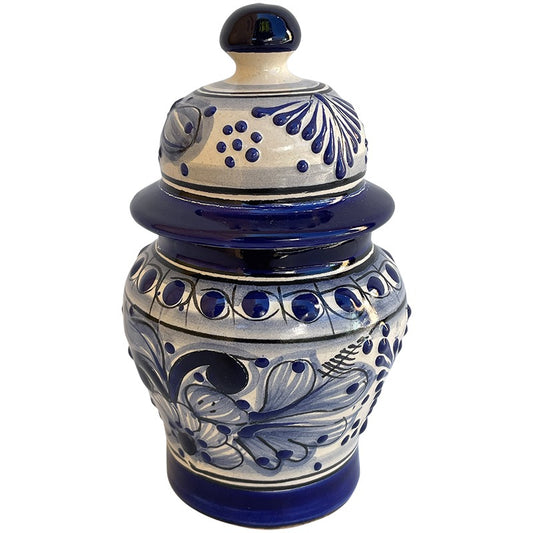 A traditional hand-painted ceramic lidded jar with a cobalt blue and cream floral pattern, set against a plain white background.