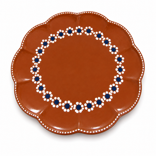 Decorative plate with a brown background and blue and white floral pattern