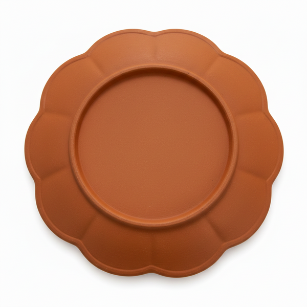 Decorative plate with a brown background and blue and white floral pattern