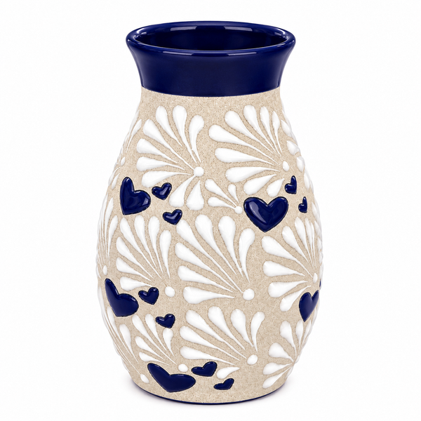 Ceramic vase with blue hearts and a blue rim on a white background