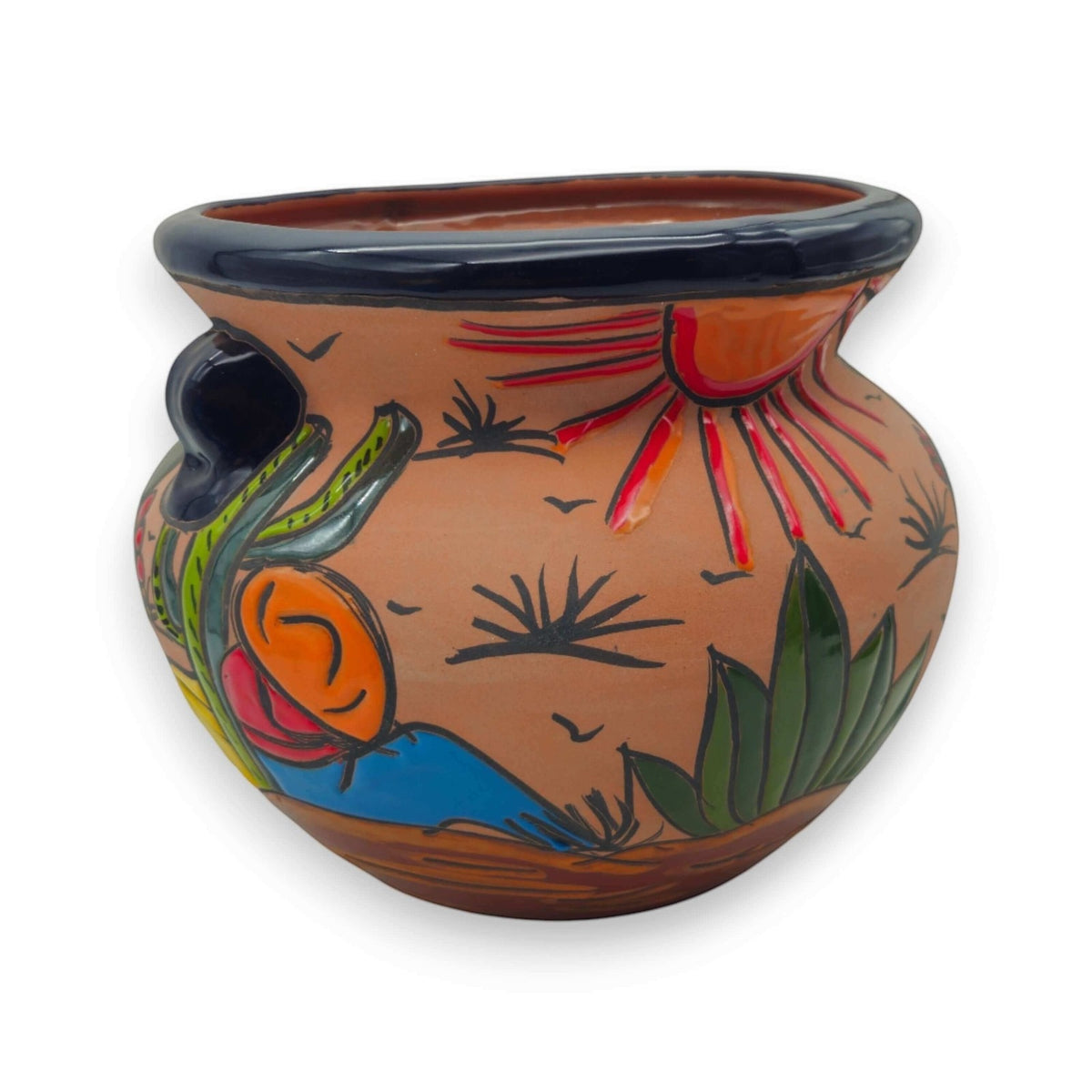 A hand-painted ceramic pot with a terracotta body, featuring a hand-drawn sun, cactus, birds, and landscape motifs in green, blue, orange, and red, set against a plain white background.
